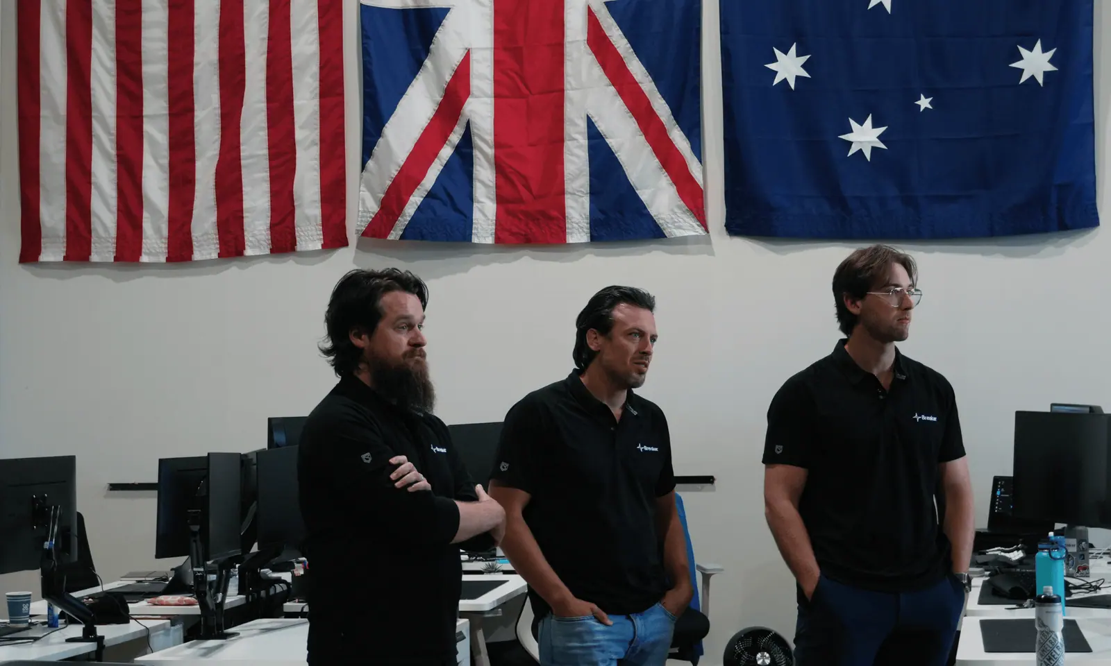 The Breaker team beneath the US, UK and Australian flags in the Austin office.