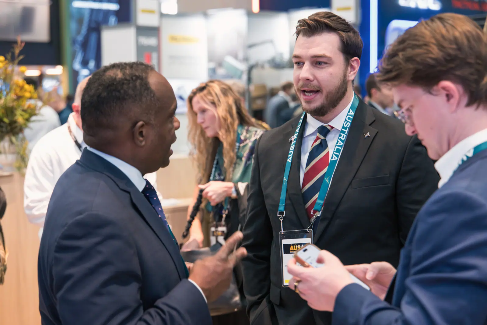 A Breaker team member in conversation with visitors on the show floor at AUSA 2026.
